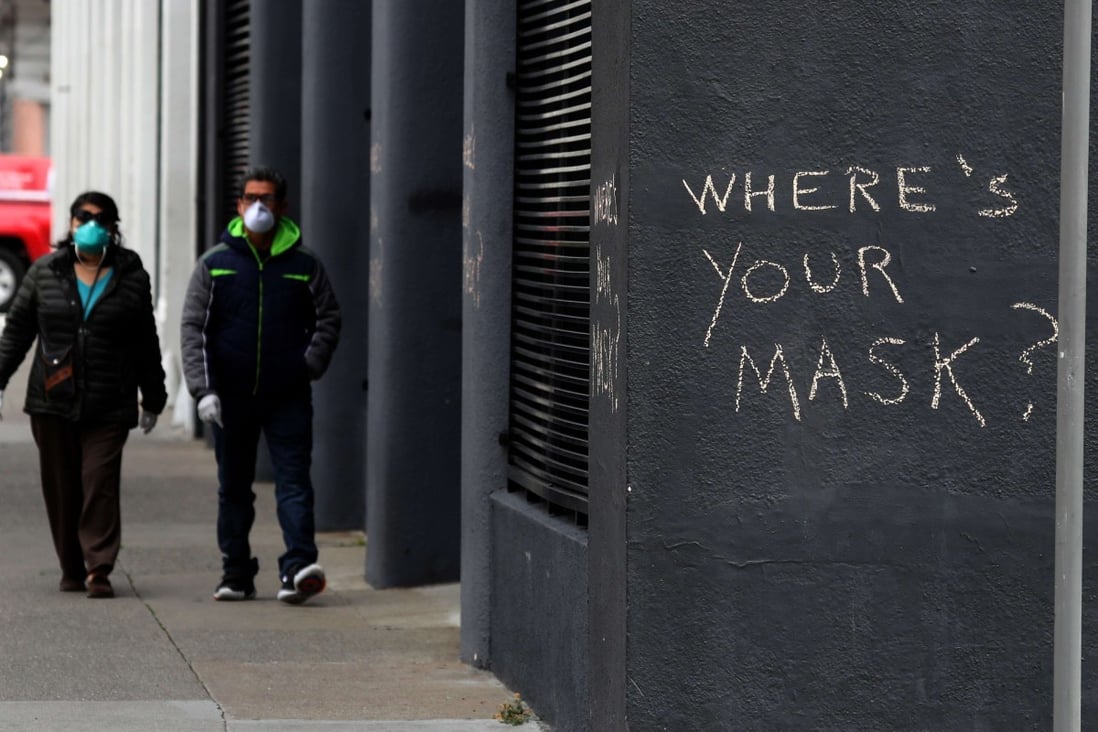 Graffiti in San Francisco, California, encouraging the wearing of masks. On Tuesday, it was announced that two residents of Santa Clara County, just south of the city, had died of the coronavirus weeks before the deaths previously believed to have been the first in the US. Photo: Getty Images via AFP