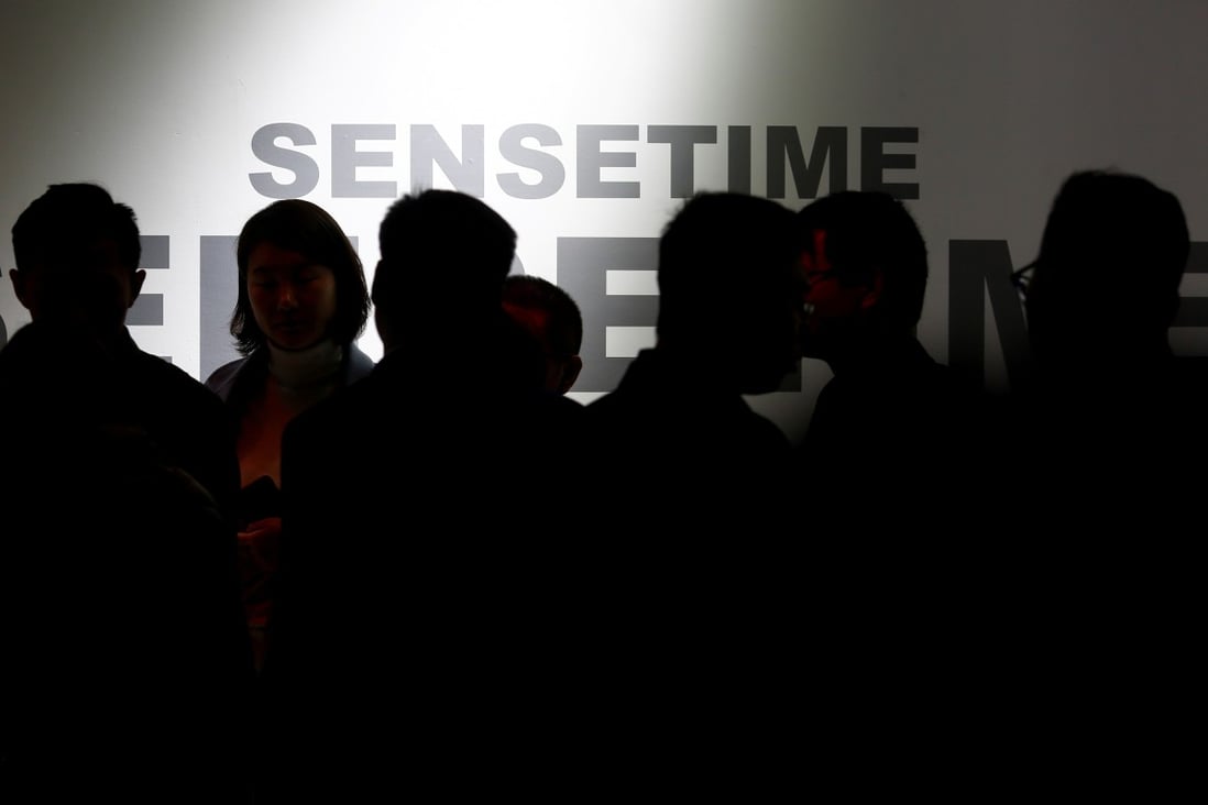 Visitors walk past the stall of SenseTime at the Security China exhibition in Beijing in October 2018. The Hong Kong-based start-up is collaborating with a unit of the People’s Bank of China to push adoption of artificial intelligence in the country’s financial industry. Photo: Reuters