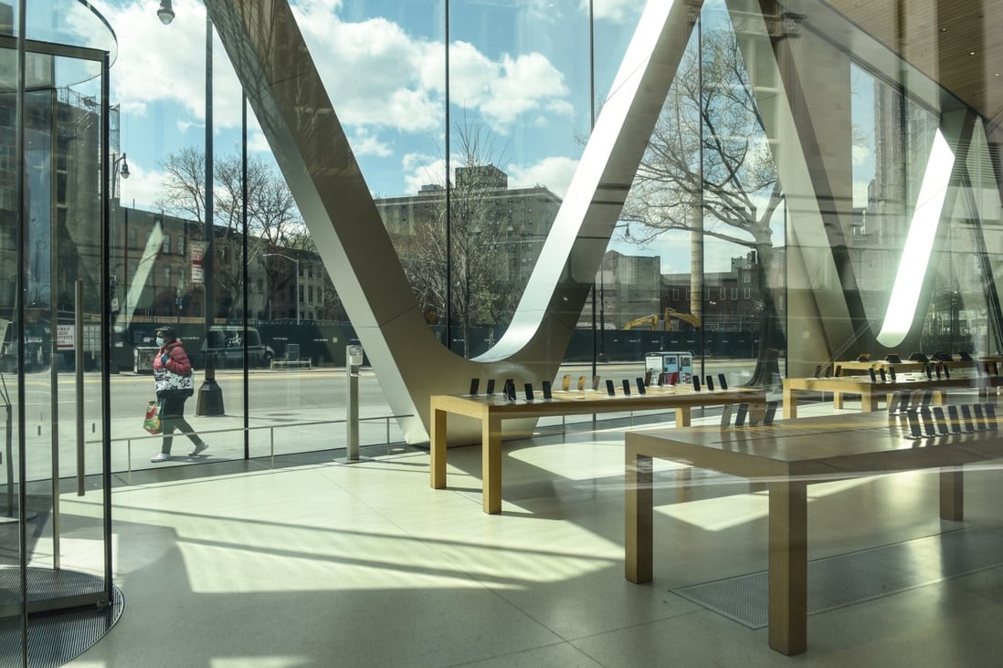 A pedestrian passes in front of a closed Apple Store in New York City on April 15. The record fall in global smartphone shipments was attributed to widespread lockdowns that included retail stores and suspension of manufacturing amid the Covid-19 outbreak. Photo: Bloomberg
