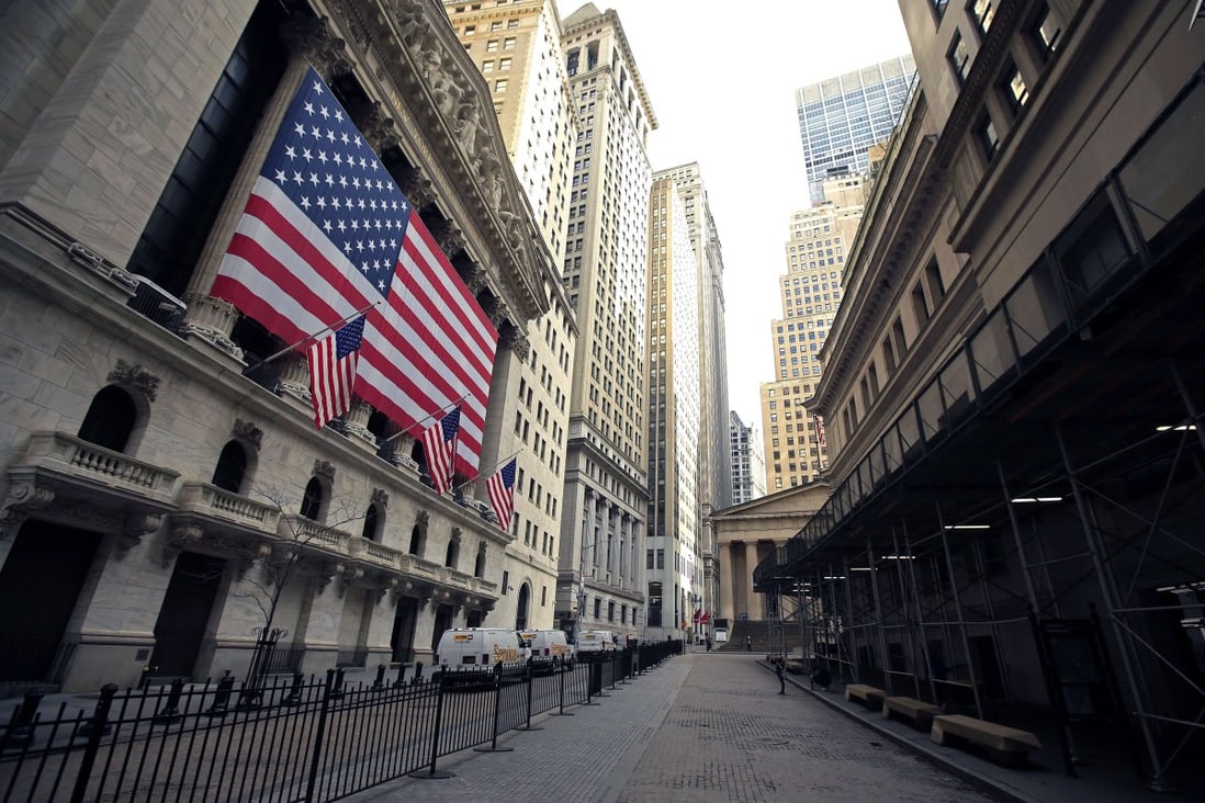 A nearly deserted Wall Street and the steps of Federal Hall are seen in lower Manhattan during the outbreak of the coronavirus disease, with the pandemic leading to the biggest American economy shrinkage since 2008. Photo: AFP