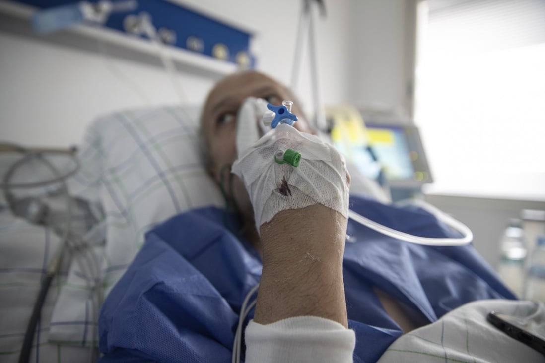 A Covid-19 patient lies on a bed at one of the intensive care unit (ICU) of a hospital in Morocco. Scientists are still piecing together information on whether people who have been infected can test positive twice. Photo: AP