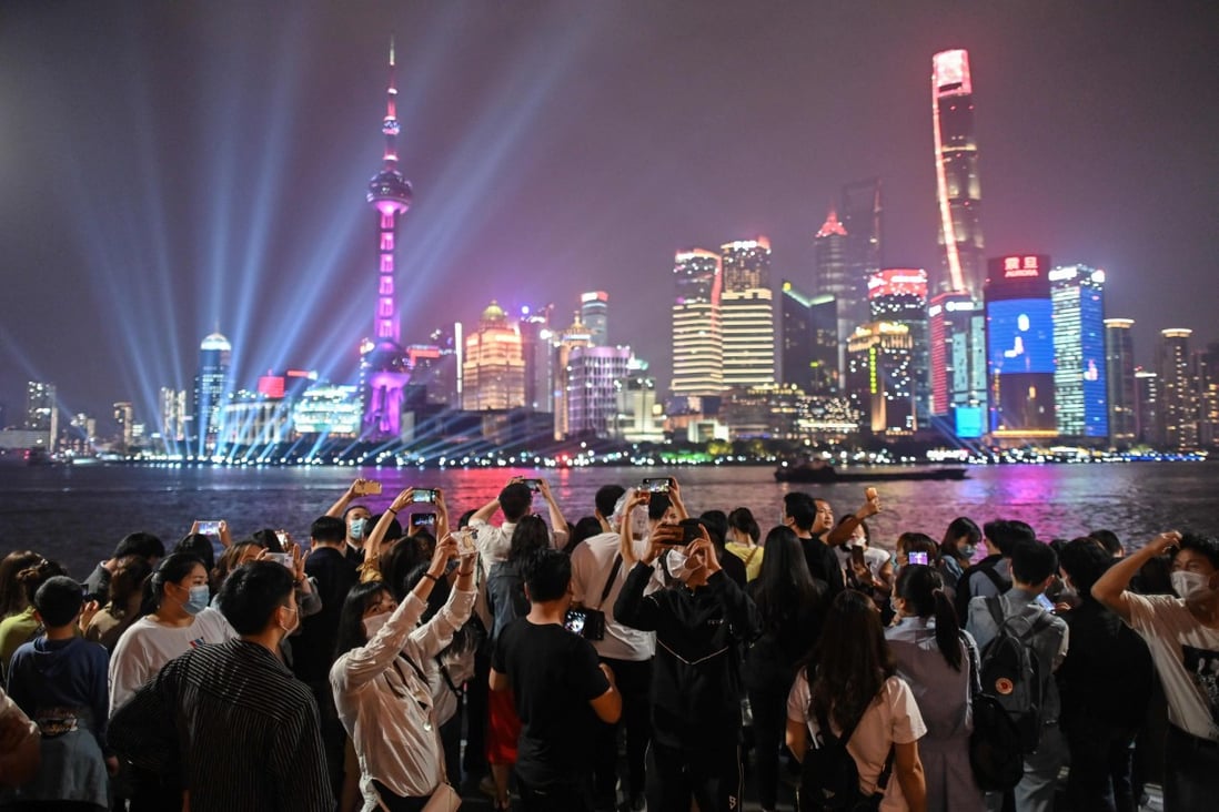 A crowd gathers on the promenade on the Bund in Shanghai to celebrate Labour Day on May 1, 2020. Photo: AFP