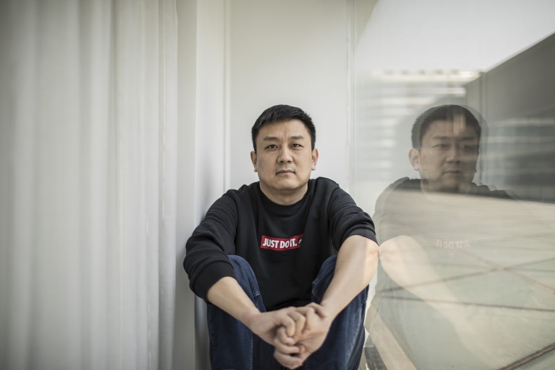 US citizen Daniel Hsu in the flat he has been renting in Shanghai. He can’t work legally in China because he has a US passport with an expired visa and the Anhui authorities won’t give him paperwork needed to get a new one. Photo: AP