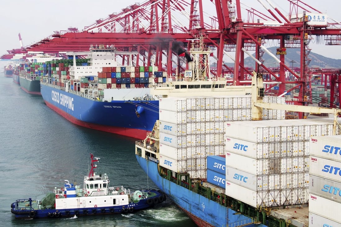 Container ships are seen at the dockyard in Qingdao, China. Both Australia and New Zealand are heavily dependent on trade with China and the Covid-19 outbreak has highlighted this. Photo: AP