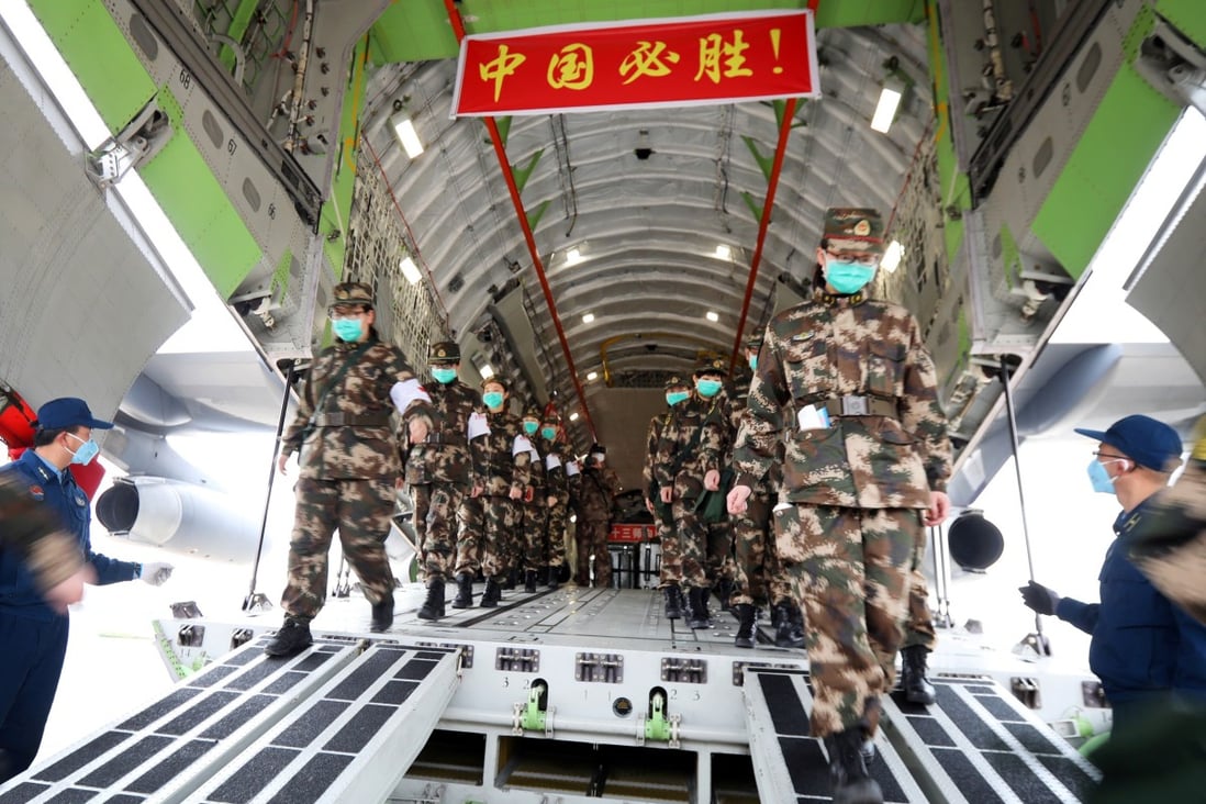 Chinese military medical personnel arriving in Wuhan in February to assist with the response to the coronavirus outbreak. Photo: Reuters