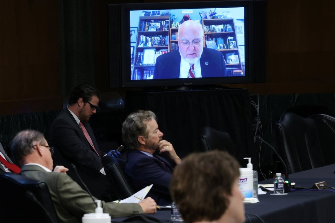US senators and staff listen to Robert Redfield, director of the Centres for Disease Control and Prevention, as he speaks remotely during a Senate committee hearing. Photo: Reuters