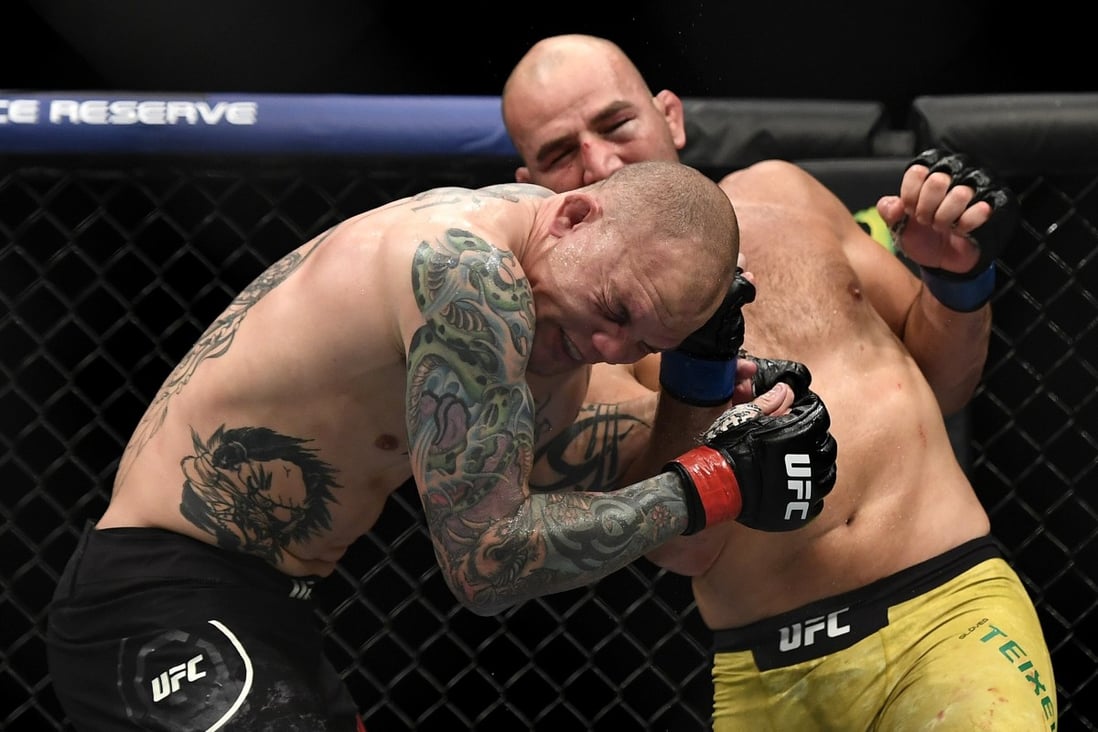 Glover Teixeira lands a shot on Anthony Smith. Photo: AFP