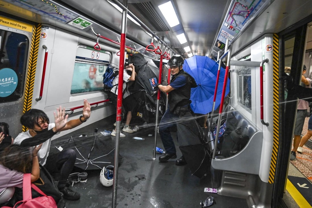 Police use force on people inside an MTR train at Prince Edward station in August. Photo: Handout