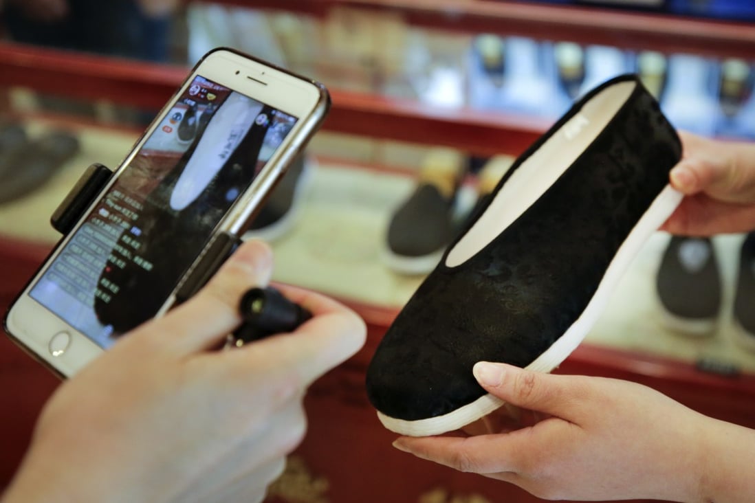 Online customers are shown a shoe in a live-stream from the Neiliansheng footwear store in Beijing. Retailers in China are embracing live-streaming as a sales channel as people continue to be wary of physical stores. Photo: AP