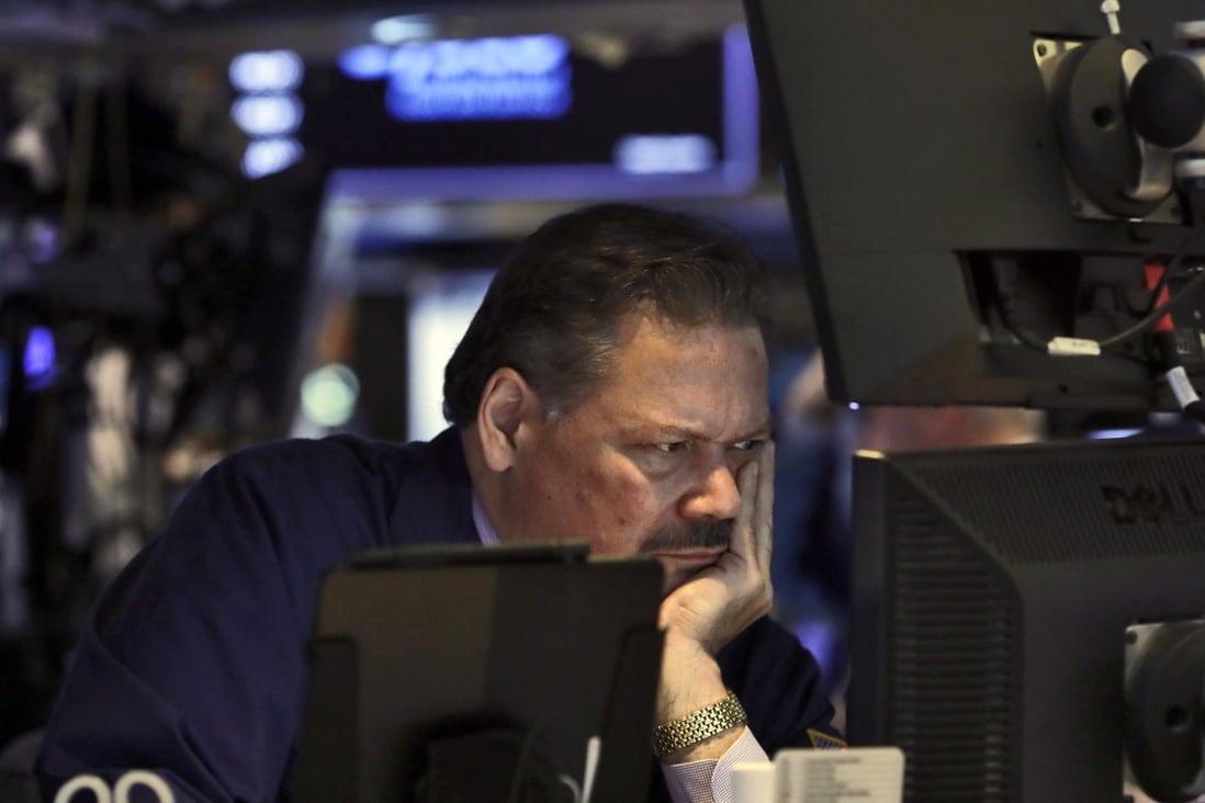 A trader on the floor of the New York Stock Exchange. Central banks may be exacerbating market vulnerabilities by increasing the scope for disorderly sell-offs when the time comes to unwind the stimulus. Photo: AP