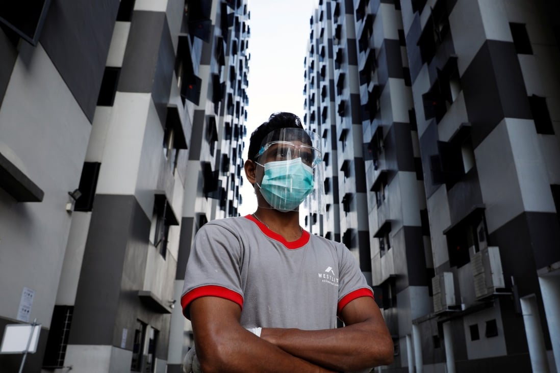 A migrant worker is seen at a dormitory in Singapore, amid an outbreak of coronavirus cases among foreign workers. Photo: Reuters