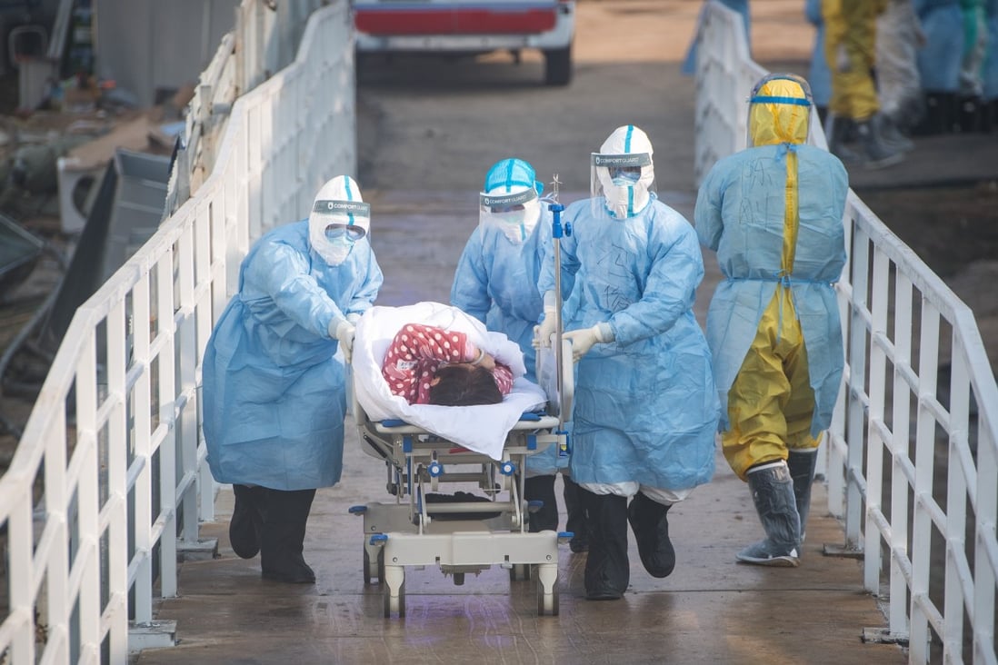Medical workers take a coronavirus patient to hospital in Wuhan, the outbreak’s initial epicentre. Photo: Xinhua