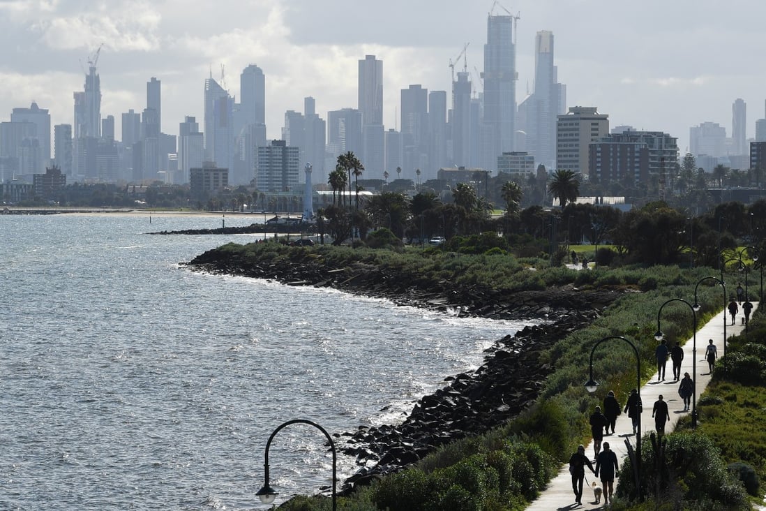 People exercise along a promenade in Melbourne. Victoria state is pushing ahead with the message that it is open to trade with China. Photo: EPA-EFE