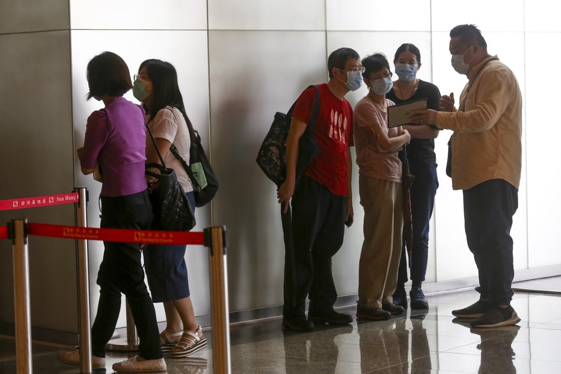 Homebuyers lining up for phase two of Wetland Seasons Park at International Commerce Centre, Kowloon Station on May 23, 2020. Photo: Jonathan Wong
