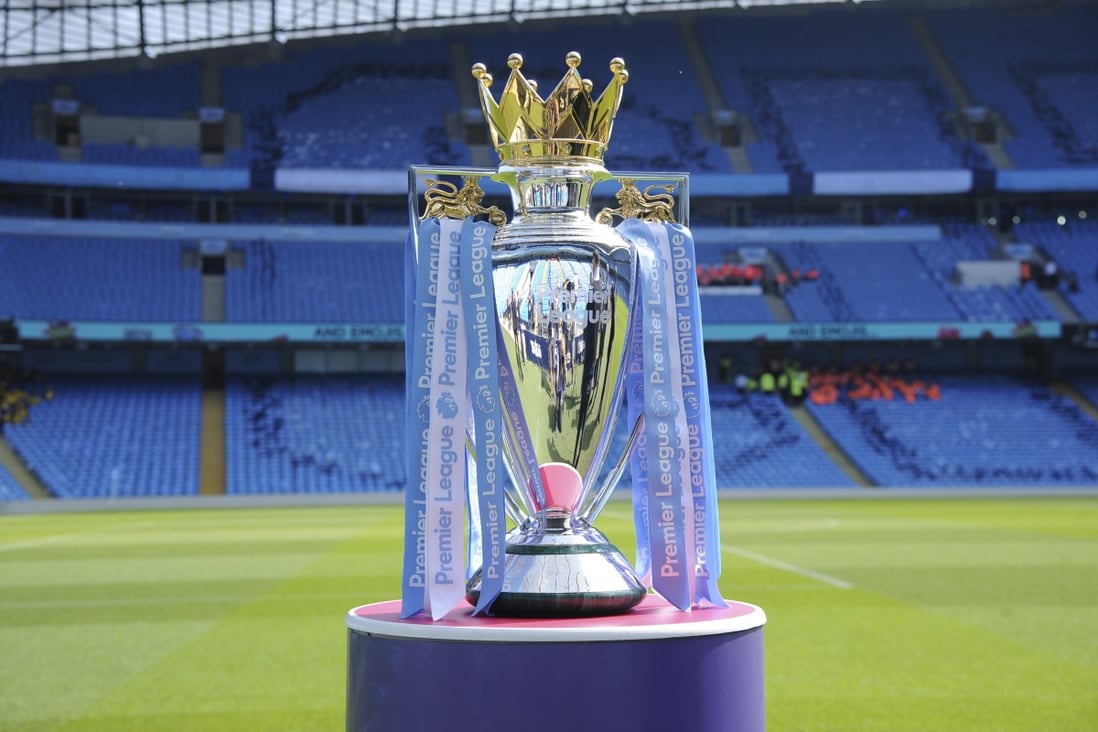 The English Premier League trophy is displayed in an empty stadium. Photo: AP