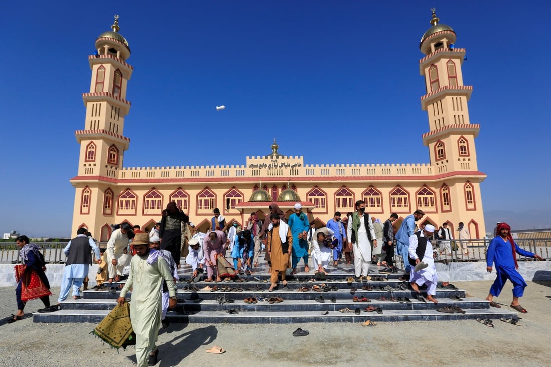 Afghan men leave a mosque after prayers during Eid al-Fitr. Photo: Reuters