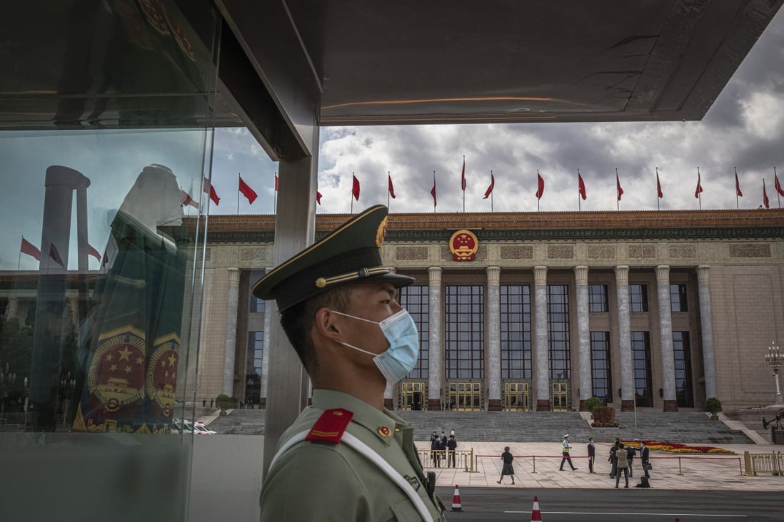 A People’s Liberation Army soldier stands guard during the annual meeting of the National People’s Congress in Beijing. Photo: AP
