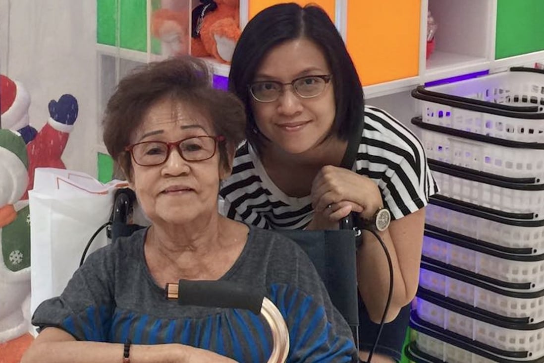 Loh Yok Hing (left), who has mild to moderate dementia and is wheelchair-bound, with her daughter and carer Cindy Teo in Singapore. As the pandemic continues, it is not uncommon for elderly people to feel lonely, anxious and stressed. Photo: Cindy Teo