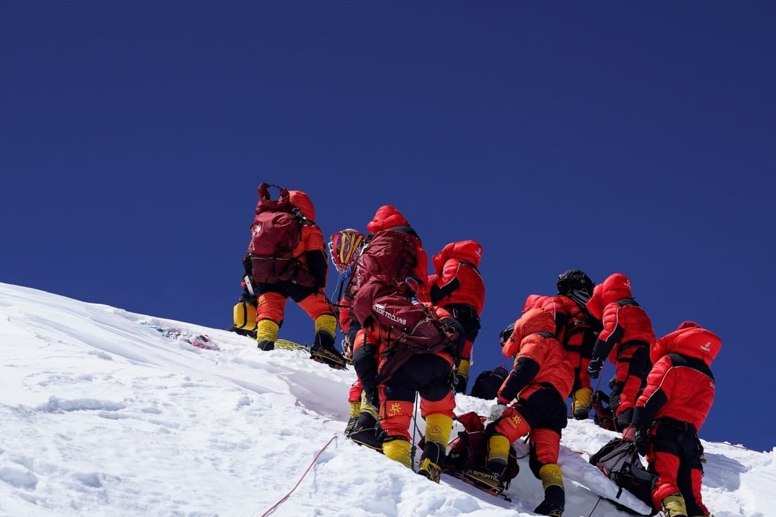 The Chinese survey team reaches the summit of Mount Everest on Wednesday after a nine-hour climb. Photo: Xinhua