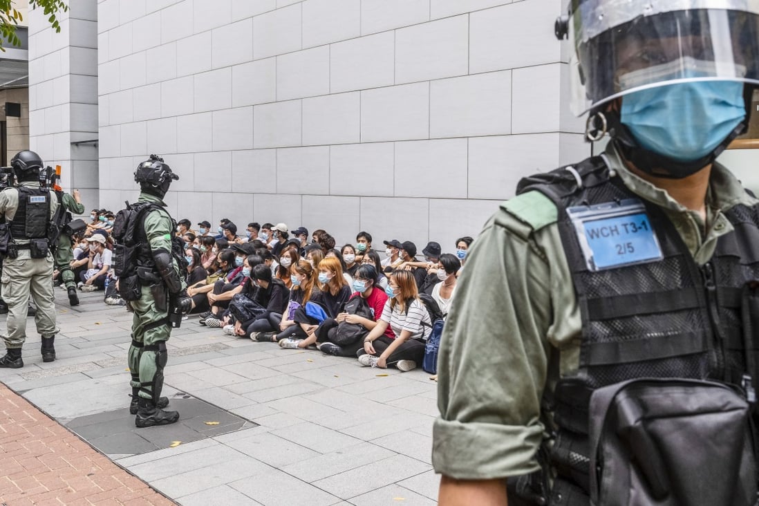 Riot police detain a group of people in Causeway Bay, Hong Kong on May 27, 2020. Photo: EPA-EFE