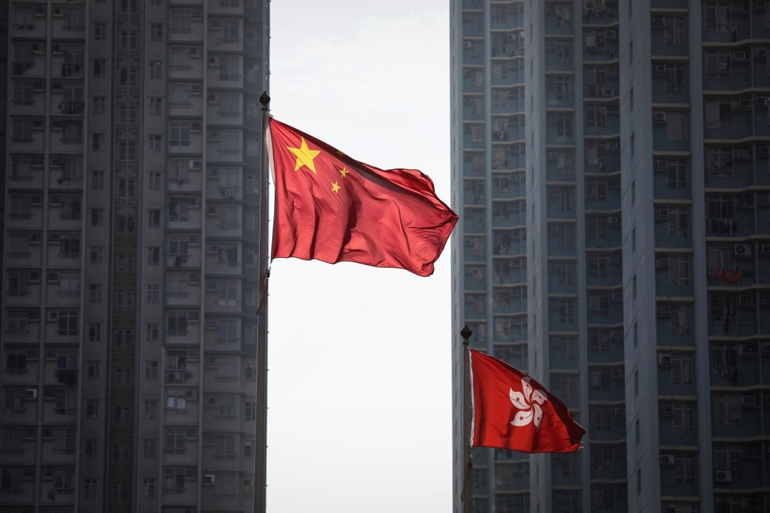 The flags of China and Hong Kong fly outside the West Kowloon Courts in Sham Shui Po. Photo: Roy Issa