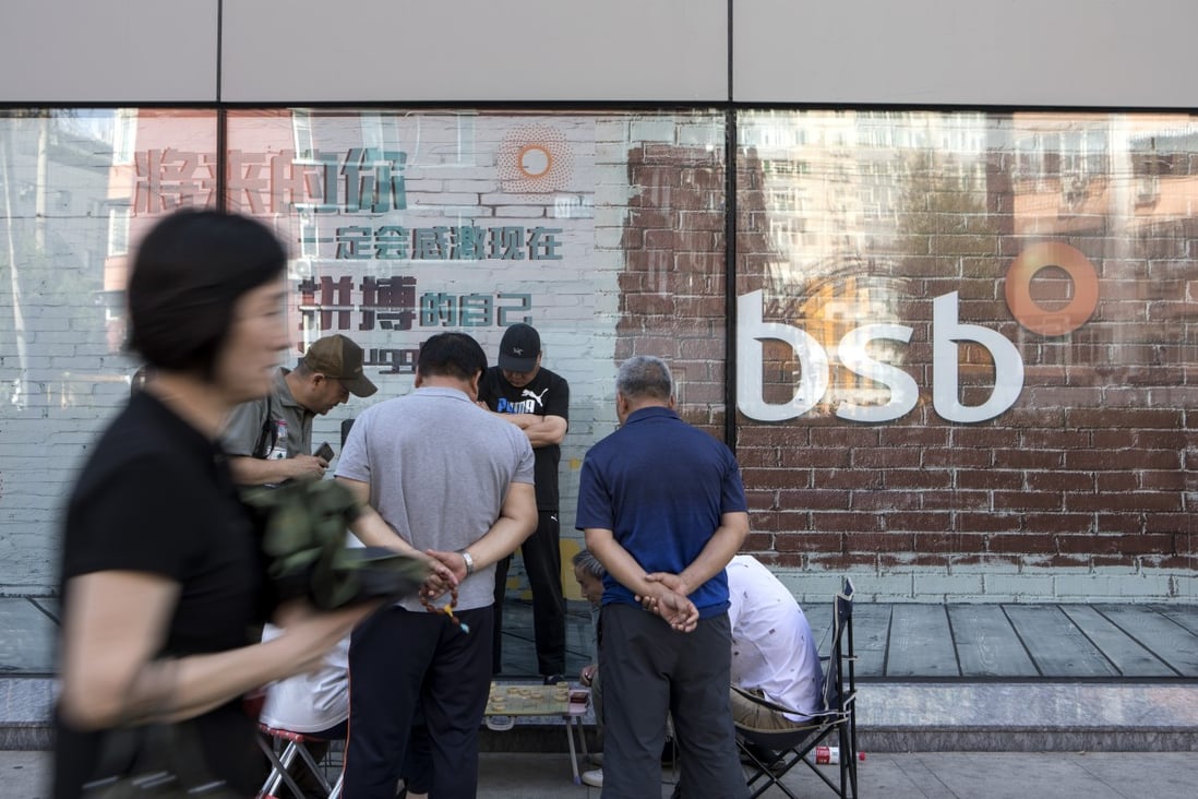 Concerns about the viability of China’s smaller banks was highlighted last year when the central bank and regulator seized control of unlisted Baoshang Bank for a year. A Beijing branch is shown here. Photo: Bloomberg