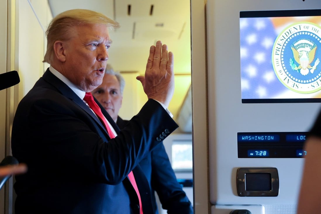 US President Donald Trump speaks to reporters aboard Air Force One while returning to Washington from Cape Canaveral, Florida. Photo: Reuters