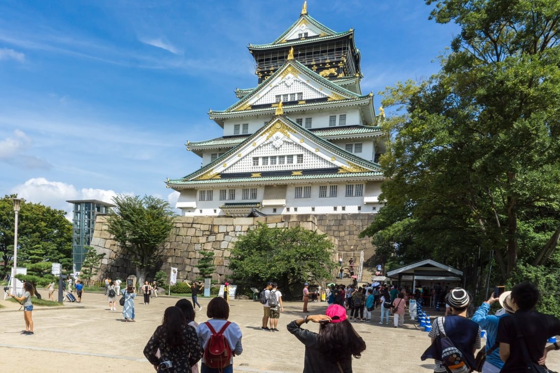 Tourists at Osaka Castle in Japan. Photo: Shutterstock