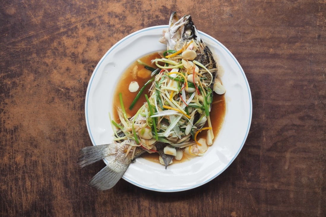 Steamed sea bass with ginger is just one of the recipes included in The Chinese Way: Healthy Low-fat Cooking from China's Regions by Eileen Yin-Fei Lo. Photo: Shutterstock