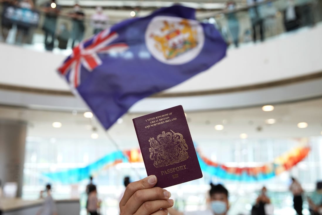 A protester holds a BN(O) passport during an anti-government demonstration at a Hong Kong shopping centre in May. Photo: Winson Wong