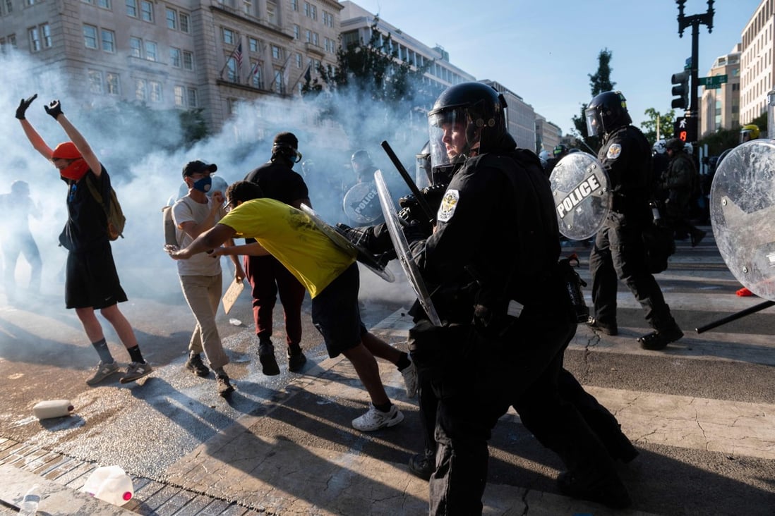 Police push back protesters near the White House during a demonstration against George Floyd’s death. Photo: AFP