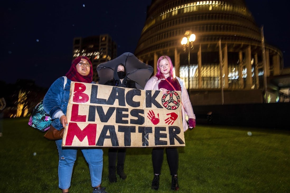 Protesters outside the New Zealand parliament in Wellington demonstrate against the killing by US police of Minneapolis man George Floyd. Photo: AFP