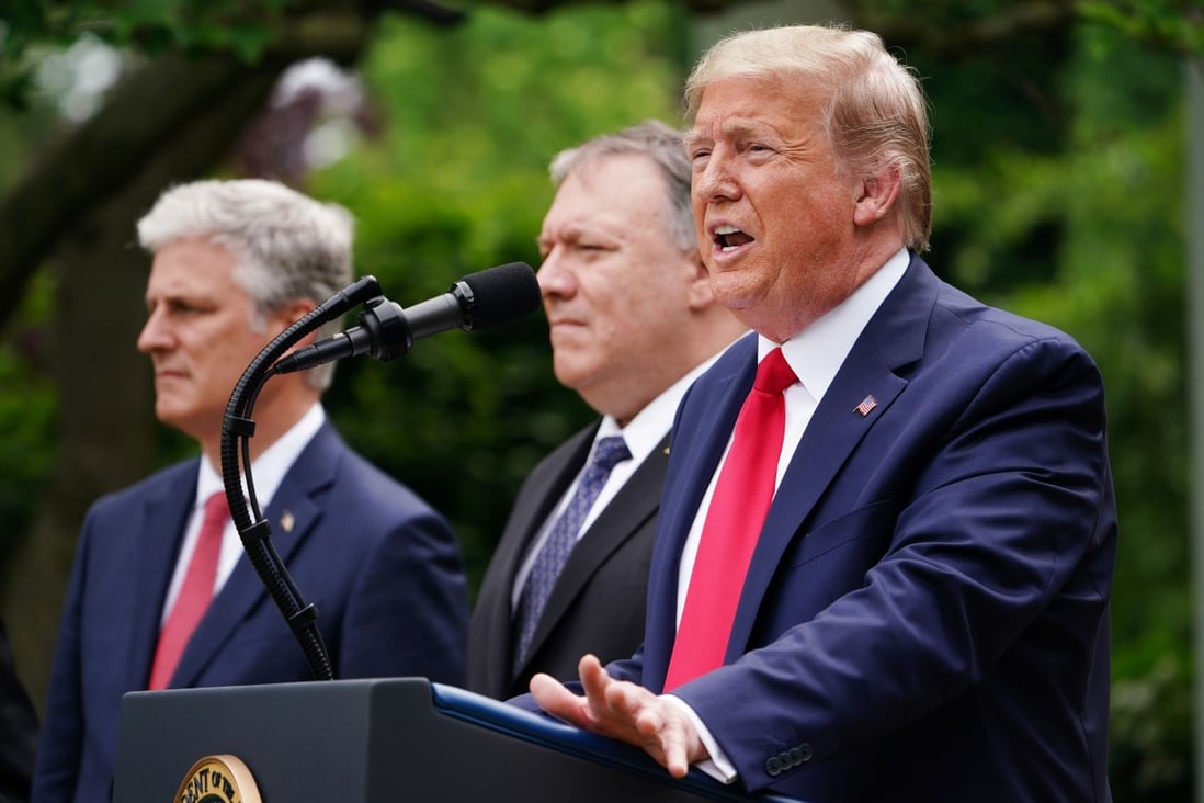US Secretary of State Mike Pompeo, centre, looks on as President Donald Trump speaks during a press conference in the Rose Garden of the White House in Washington on May 29. Trump and Pompeo have publicly said Hong Kong is no longer sufficiently autonomous from China to receive special trade treatment from the United States. Photo: AFP