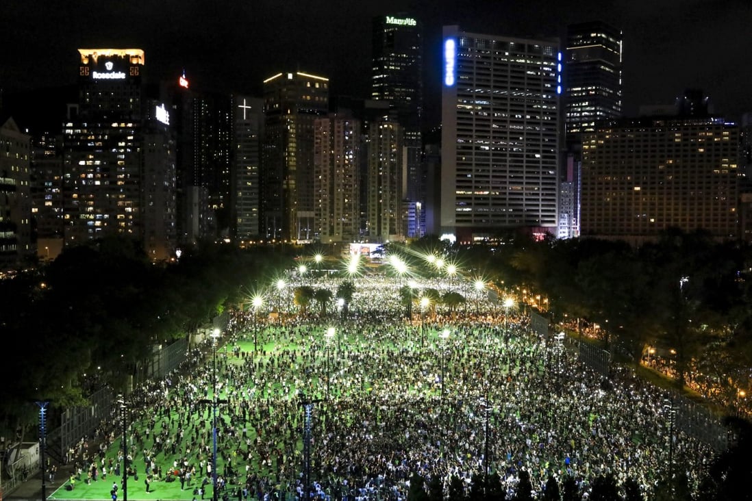 People gather on the football pitches at Victoria Park in Causeway Bay. Photo: May Tse