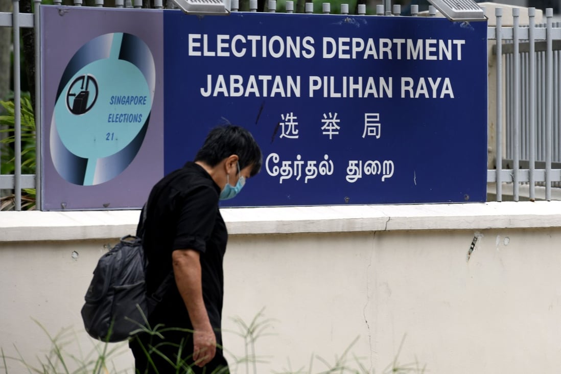 A man walks past the Elections Department centre in Singapore on June 8. The city state has announced special measures for elections during the Covid-19 pandemic. Photo: AFP
