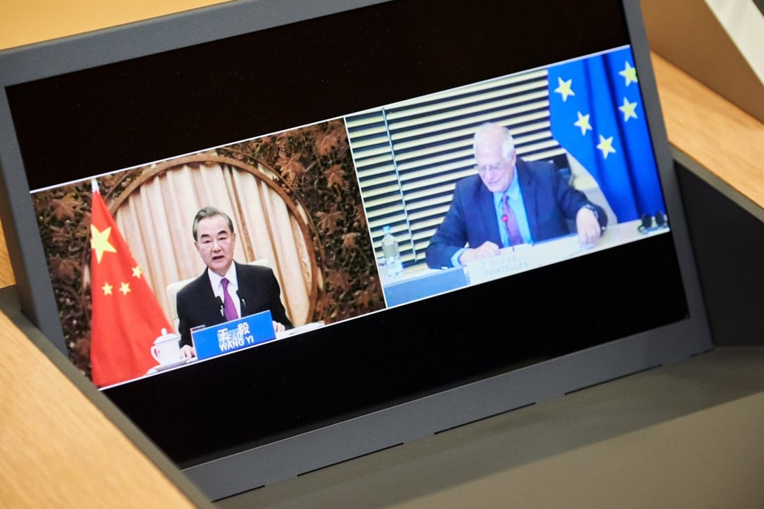 Chinese Foreign Minister Wang Yi (left) and Josep Borrell, the EU high representative for foreign affairs, on a screen during a videoconference meeting of the EU-China Strategic Dialogue on Tuesday. Photo: Dati Bendo/European Commission via dpa
