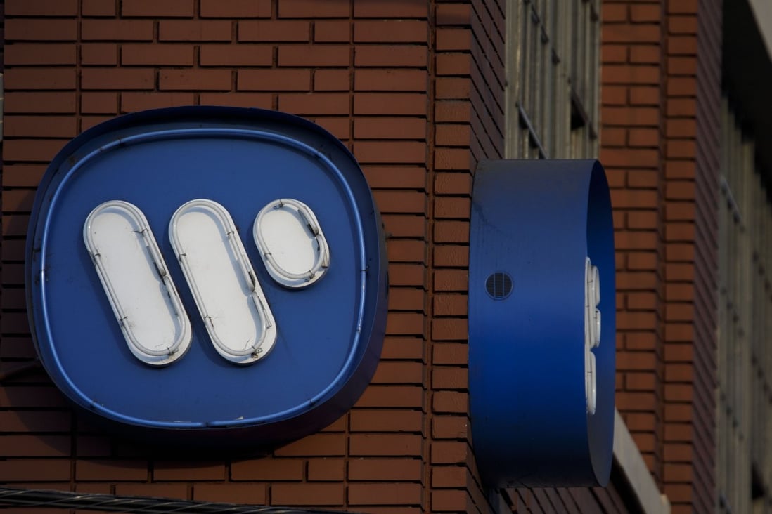 The Warner Music Group logo is displayed outside the company's headquarters in the Arts District neighbourhood of Los Angeles, California, on June 3. The group’s shareholders raised $1.93 billion in an initial public offering that ranks as one of the biggest US listings this year. Photo: Bloomberg