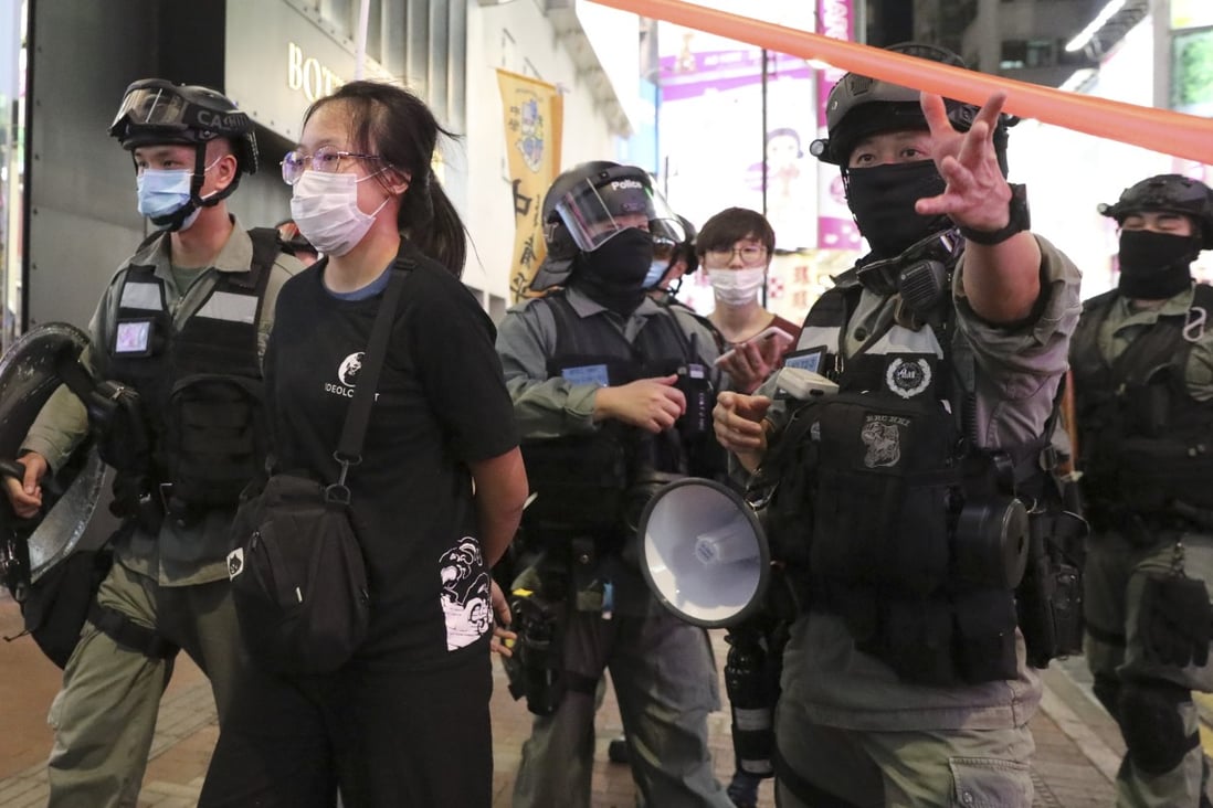 Police take away a woman arrested at a protest in Causeway Bay. Photo: Dickson Lee