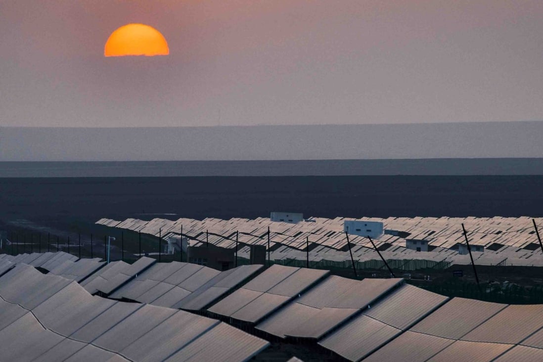 The sun sets over a photovoltaic power plant in Turpan in northwest China’s Xinjiang Uygur Autonomous Region in September 2018. China has been trying to ensure the solar power sector can survive without subsidies. Photo: Xinhua