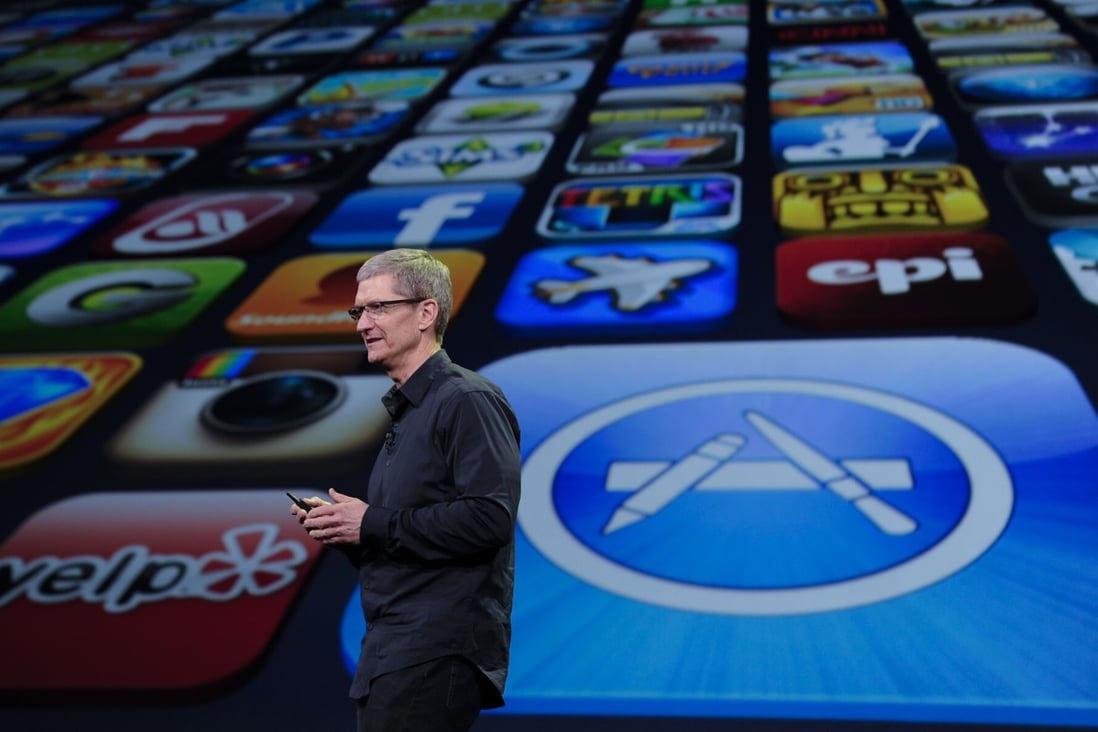 Apple chief executive Tim Cook said the company’s App Store, represented by the large icon in the background, “provides enduring opportunities for entrepreneurship, health and well-being, education, and job creation” in a challenging time. Photo: Xinhua