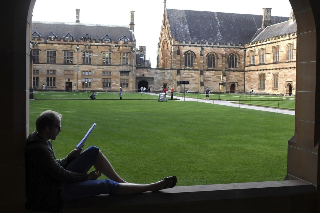 A student reads at the Quadrangle of the University of Sydney. File photo: AAP Image via AP