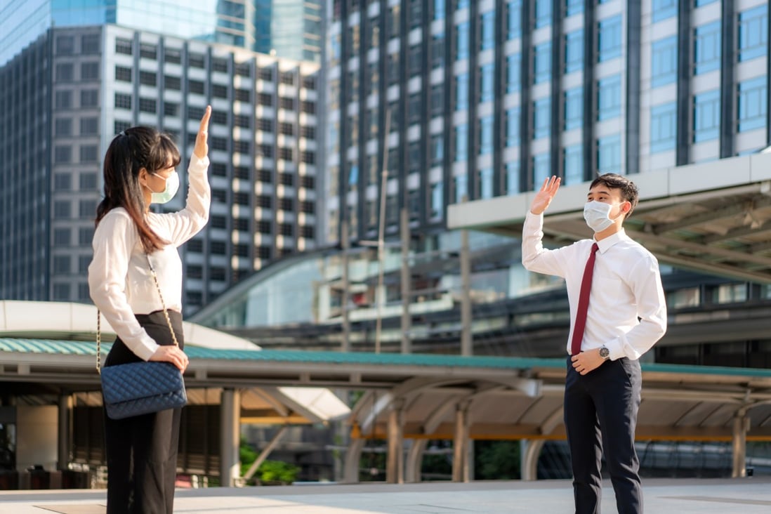 The Covid-19 pandemic has changed how we interact. Greet people with a wave and a nod of the head or a slight bow, a Singapore-based etiquette expert advises. Photo: Shutterstock