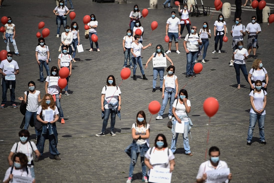 Nurses stage a flashmob protest over wages in Rome, as Italy eases its lockdown aimed at curbing the spread of the coronavirus. Photo: AFP