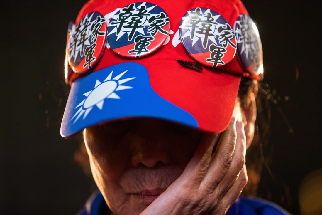 An attendee covers her face during a Kuomintang rally on January 11. Photo: Bloomberg