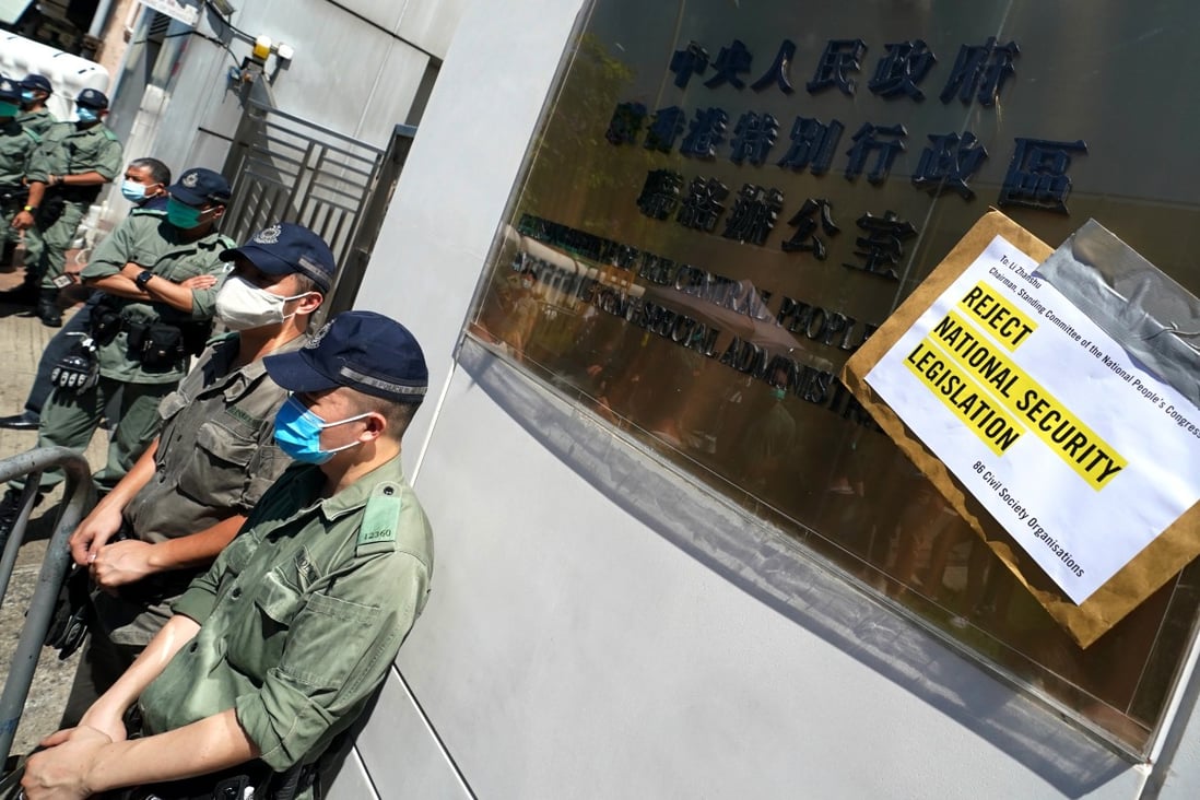 A petition letter stuck to the central government’s liaison office in Sai Ying Pun, as members of Amnesty International Hong Kong protest against the National Security Law. Photo: Felix Wong
