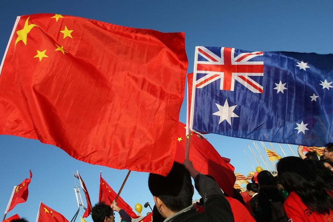 Chinese and Australian flags are seen in Canberra. There has been a sustained increase in anti-Chinese and more broadly anti-Asian racial abuse in Australia, especially after the coronavirus outbreak. Photo: AFP