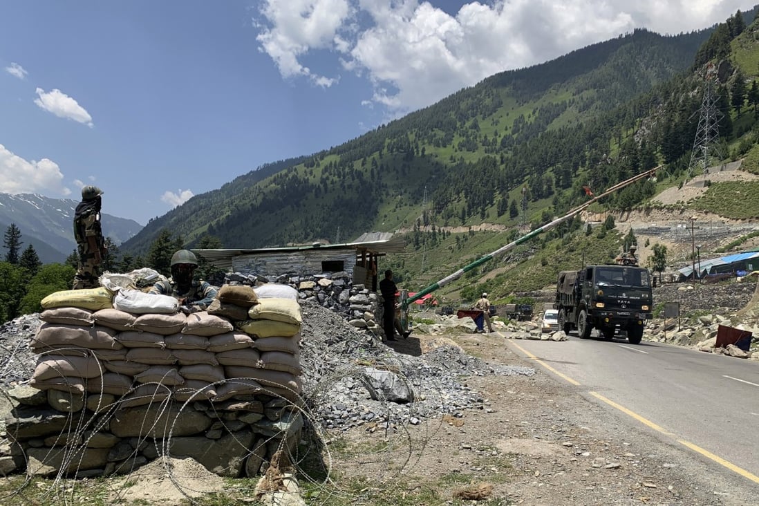 Indian soldiers keep guard as an army convoy moves on the Srinagar-Ladakh highway at Gagangeer, India on June 18. India has cautioned China against making “exaggerated and untenable claims” to the Galwan valley area even as both nations tried to end the stand-off. Photo: AP