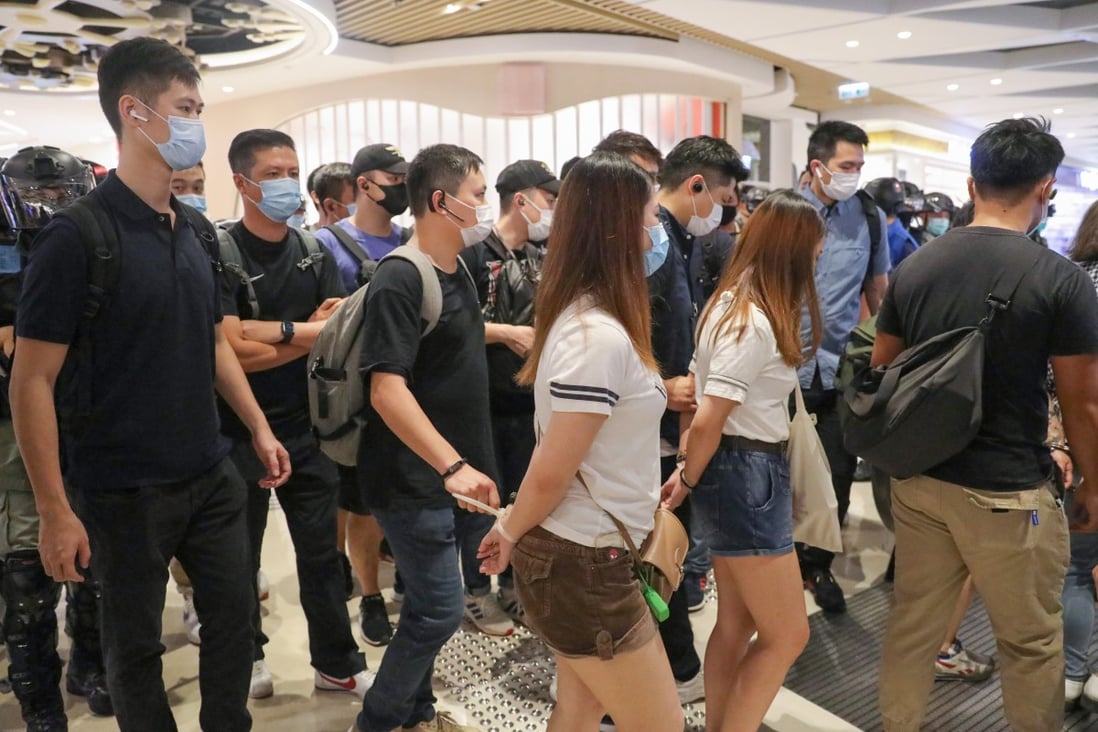 Plain-clothes officers take away some of those arrested in Yoho Mall. Photo: Dickson Lee
