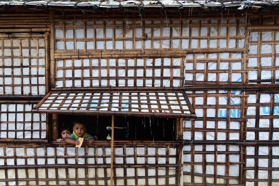 Rohingya children look out from their makeshift home at Kutupalong refugee camp in Ukhia, Cox’s Bazaar. Photo: AFP