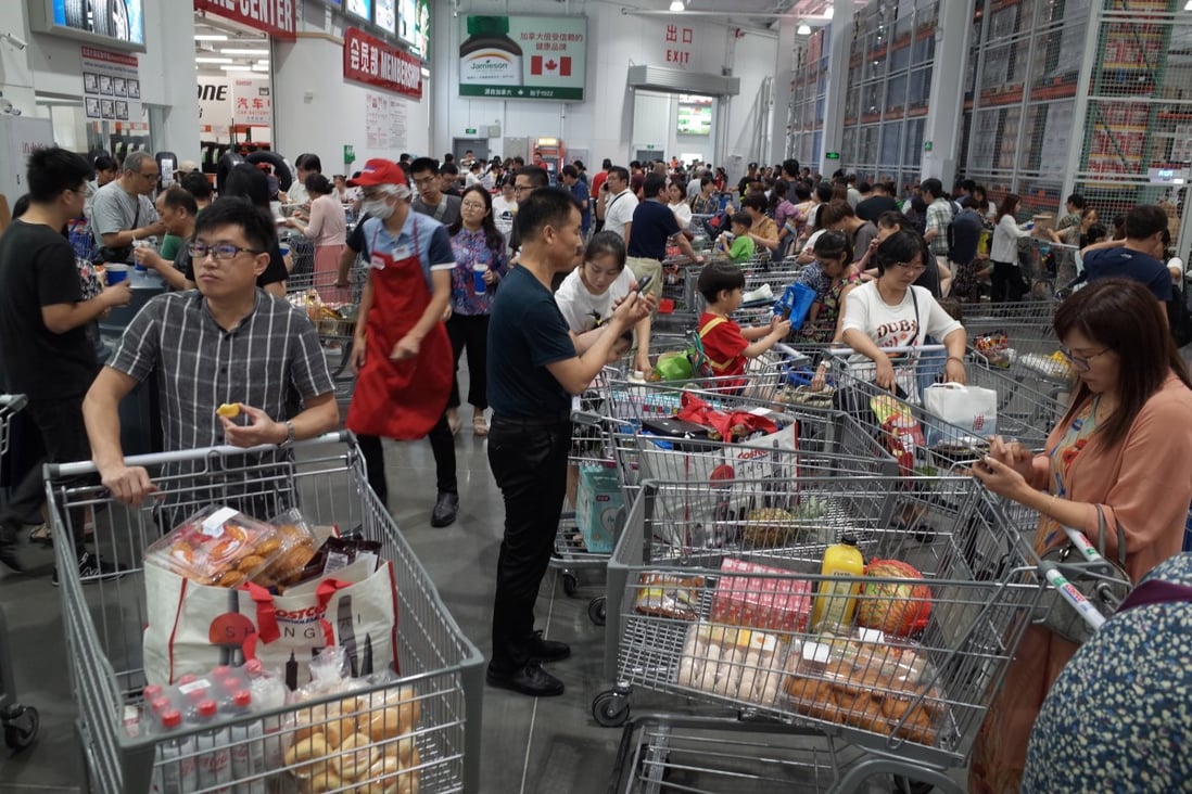 Chinese consumers throng a Costco Wholesale store in Shanghai during the first week of its opening in August last year. The coronavirus pandemic has dented Chinese consumers’ appetite for higher priced goods. Photo: EPA-EFE